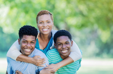 A woman smiling with her kids