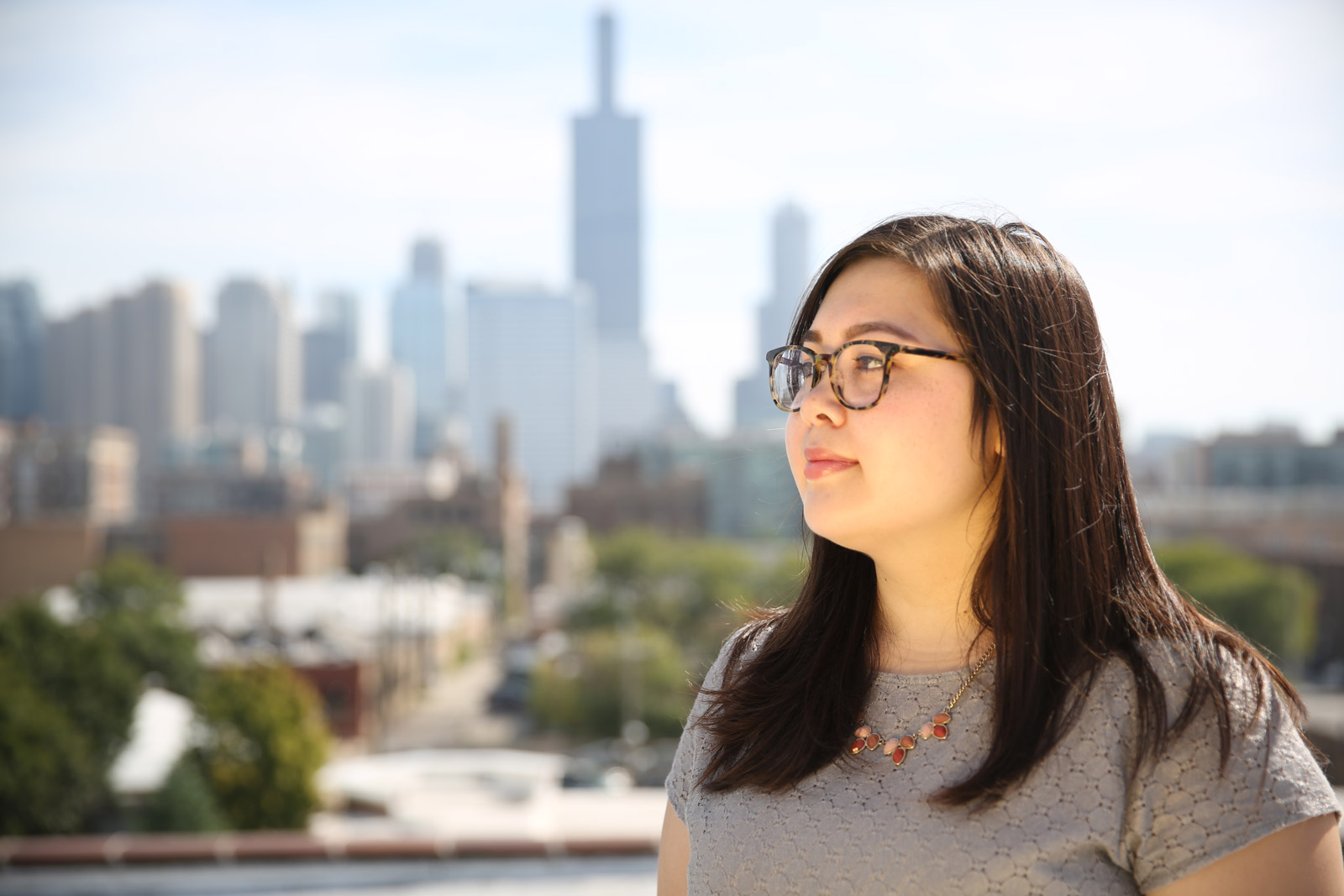 Woman with skyline behind her