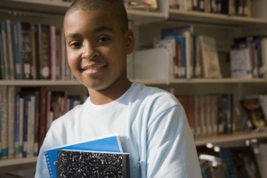 Omar with notebook in library