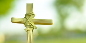 Cross made out of palm fronds.