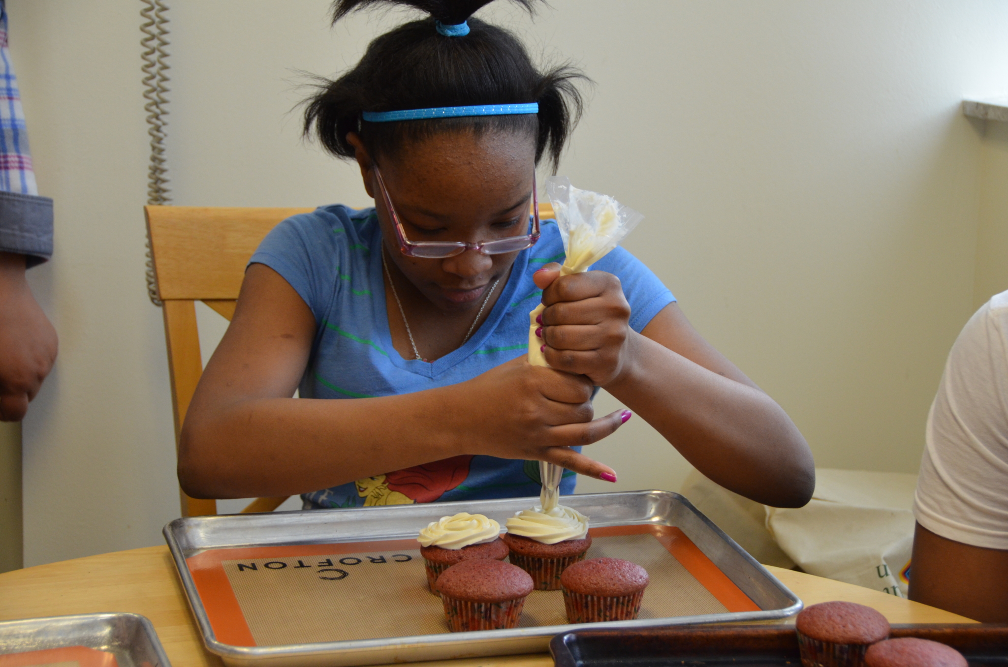 Youth decorating cupcakes