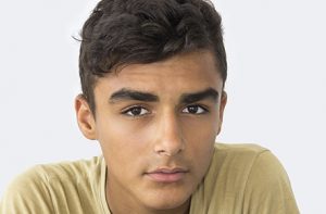 Young boy looking into camera