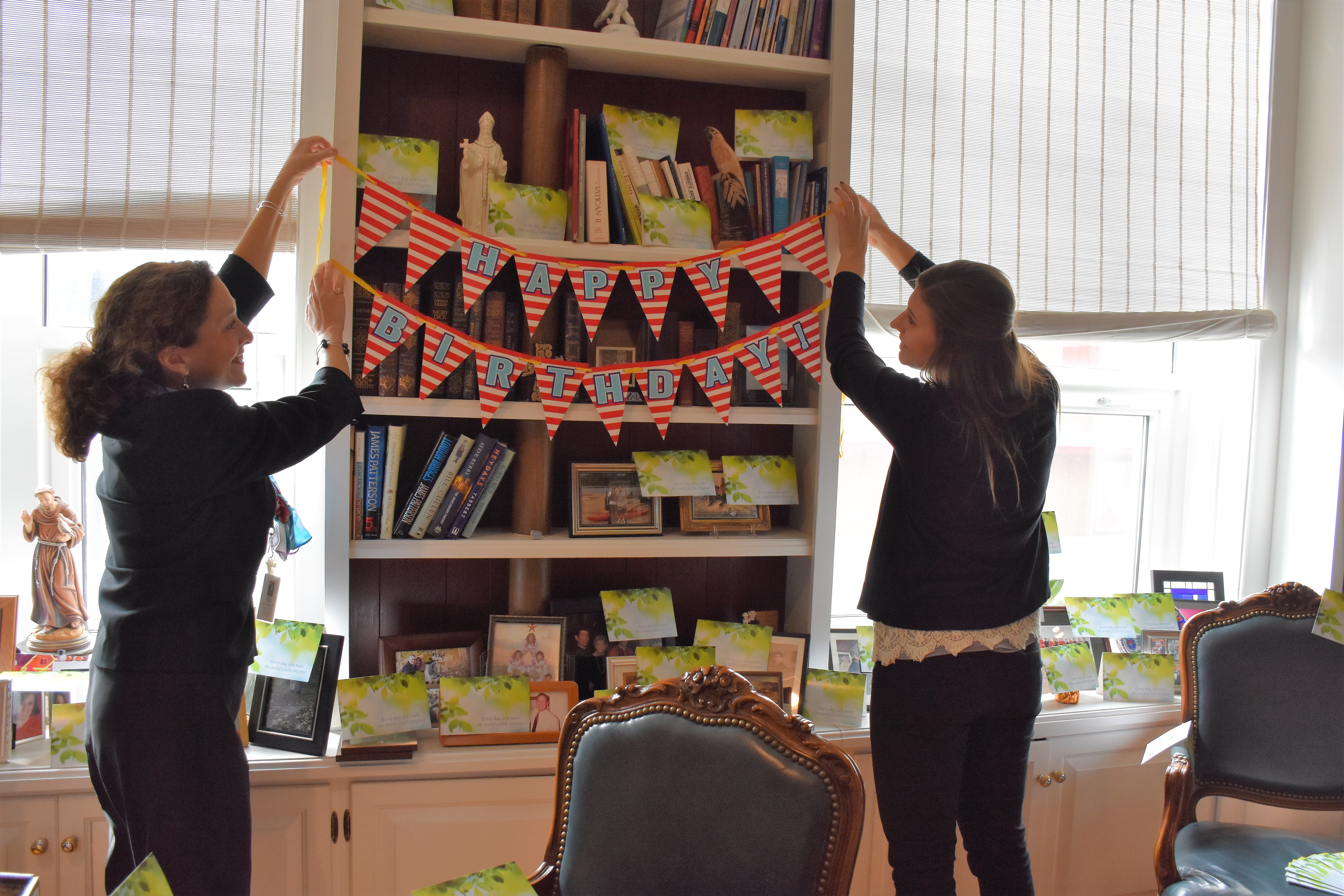 Friends fill his office with birthday blessings.