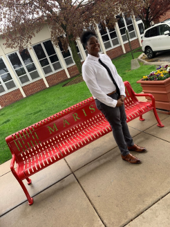 Girl in front of bench