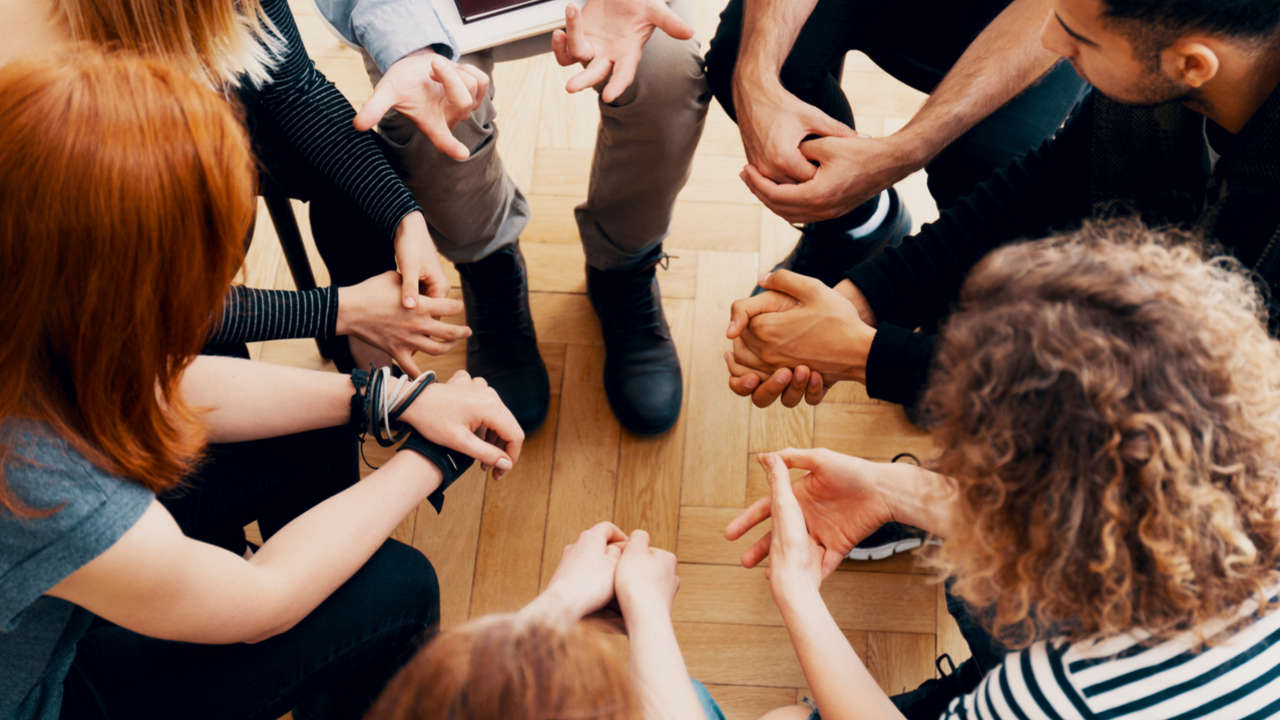 Group of people sitting in a circle