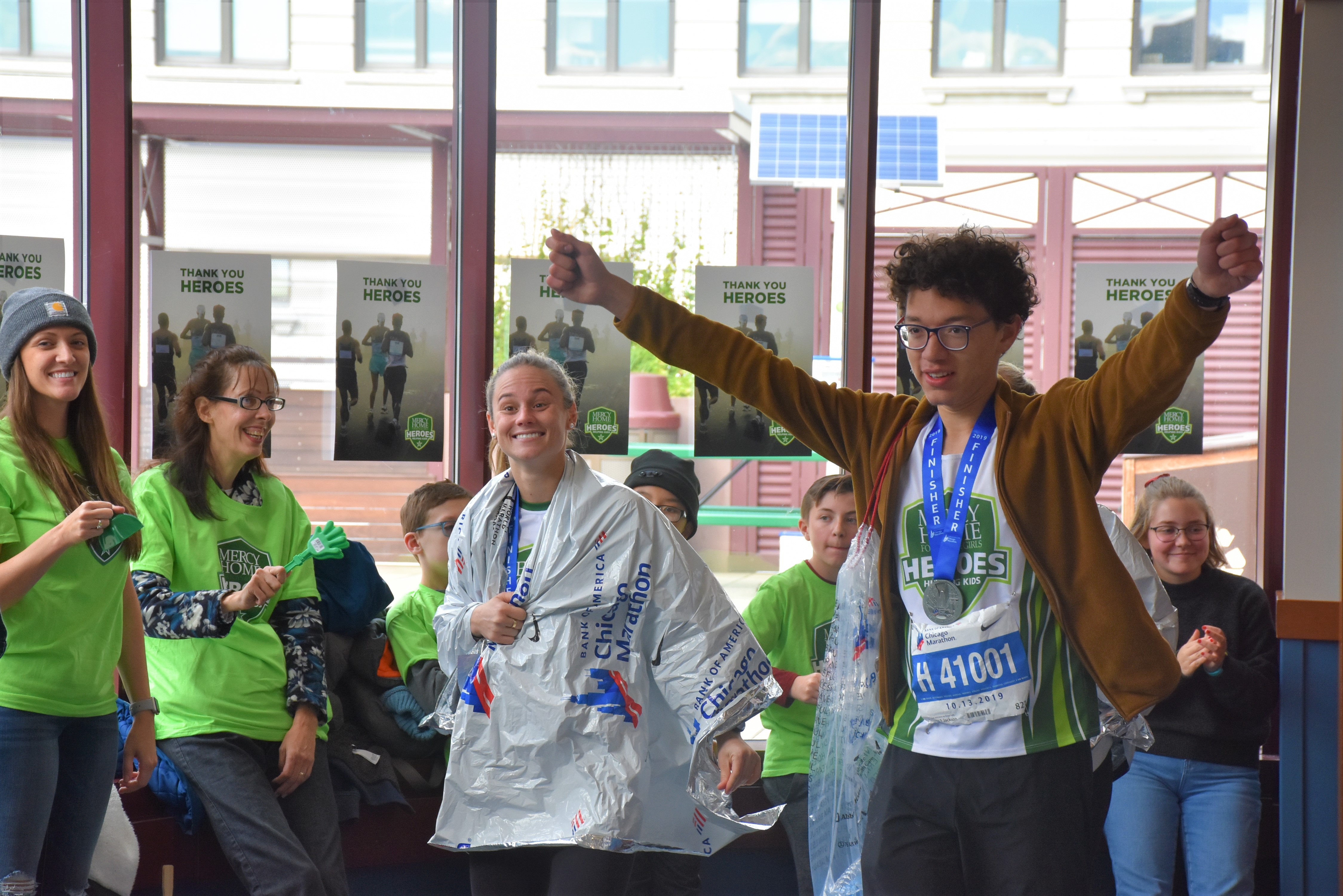 Mercy Home youth Carlos at HQ after running marathon