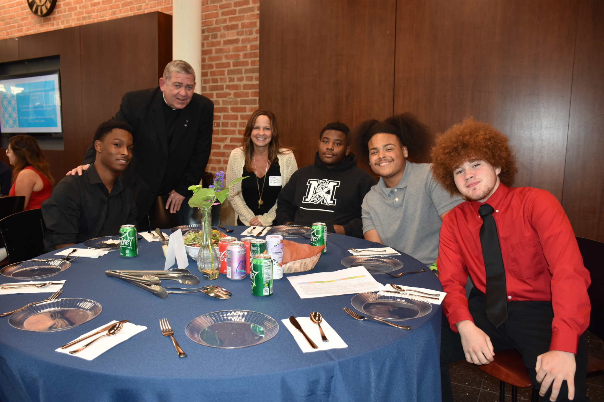 Fr. Scott with youth and female employee for the employer appreciation dinner