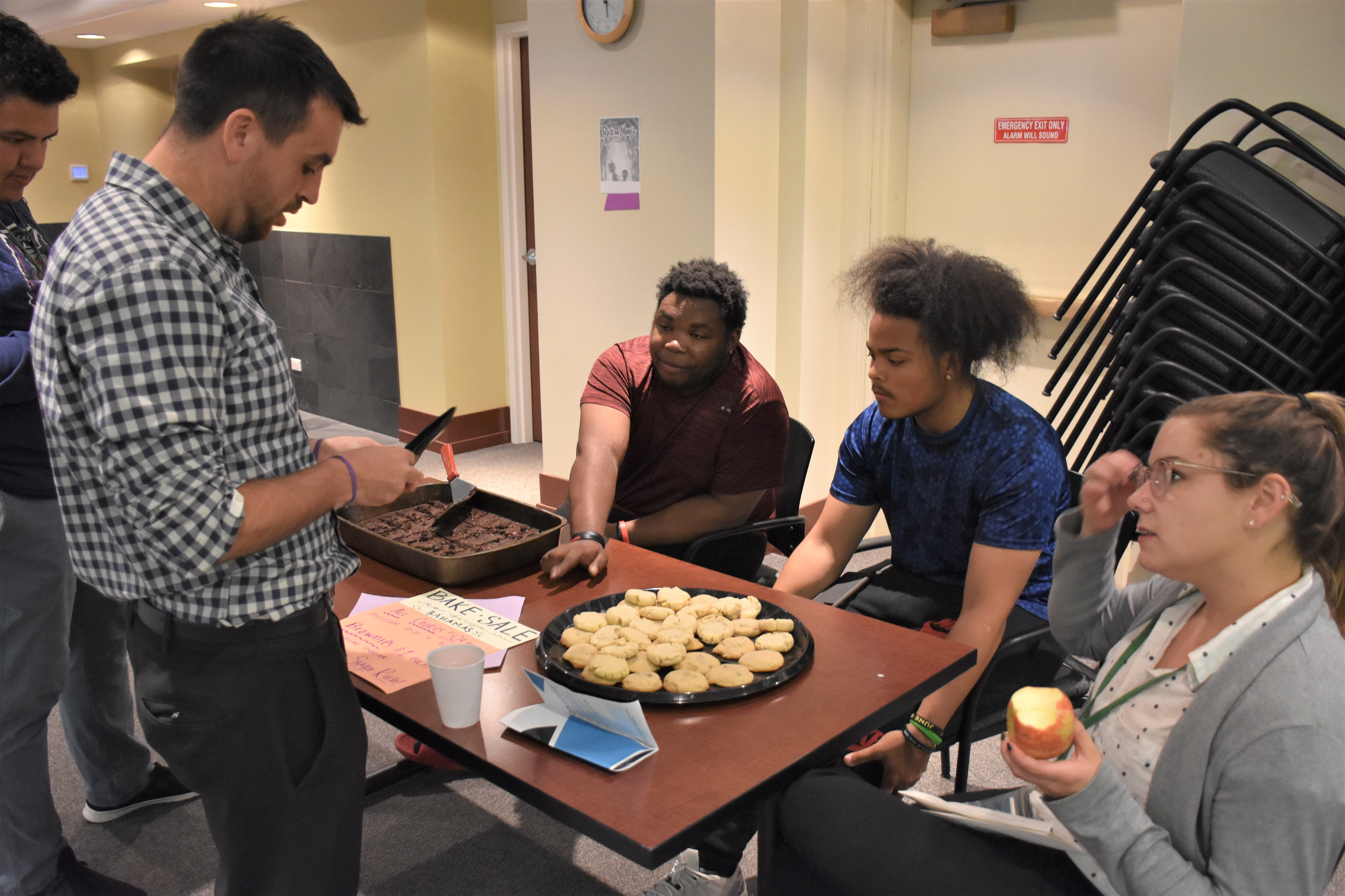 Mercy Home youth running a bake sale table