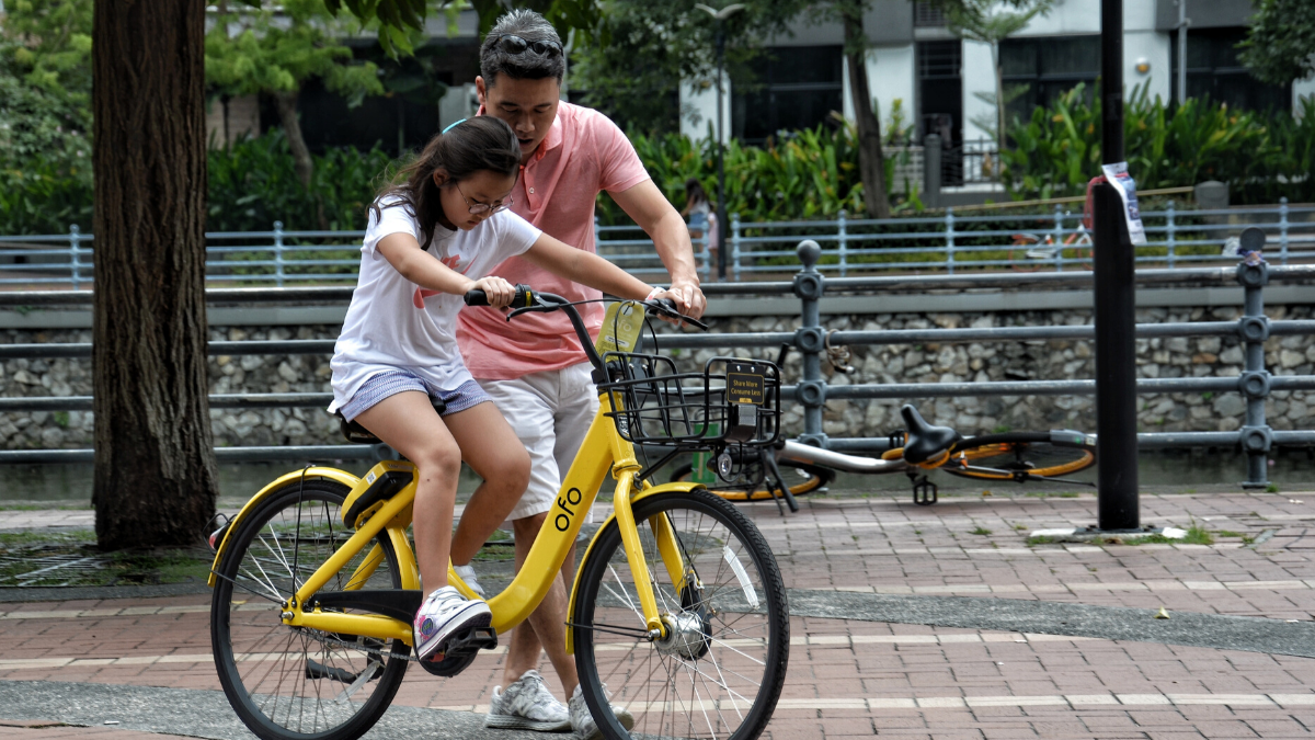 young girl riding her bike