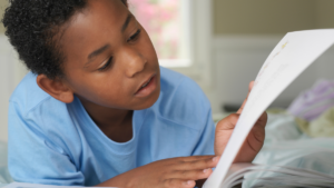 young boy reading