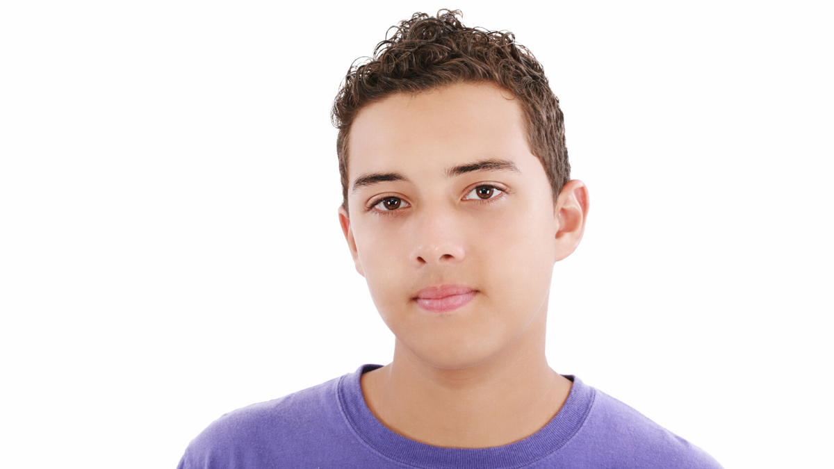 young boy in purple shirt