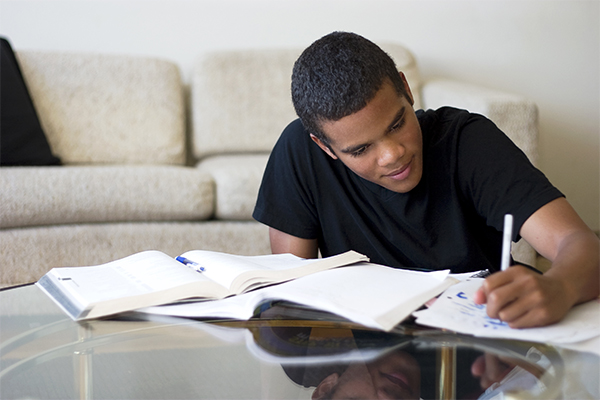 young boy doing homework