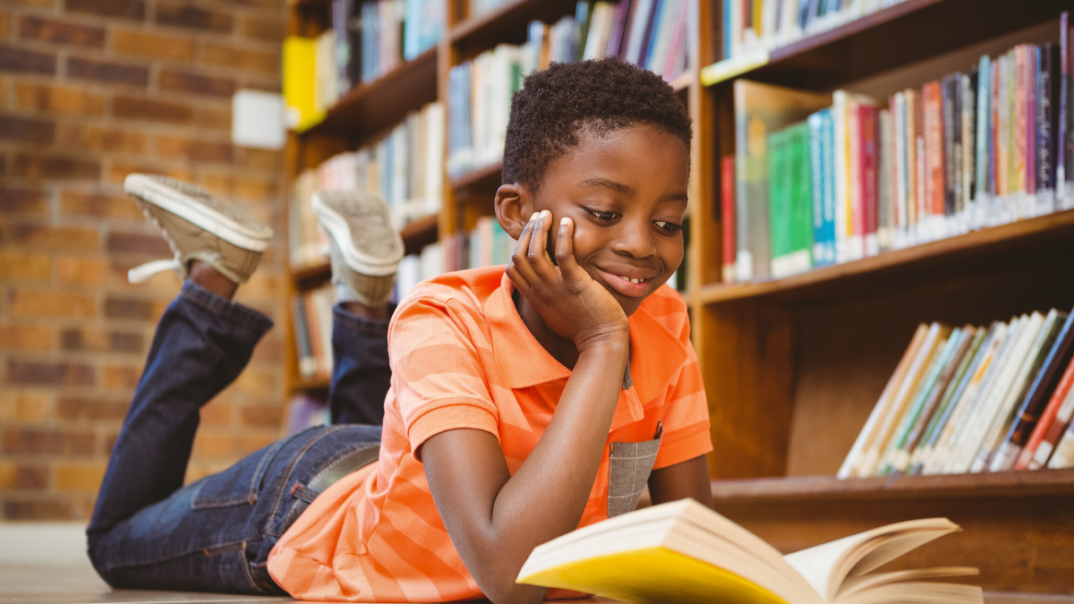 young boy with a book