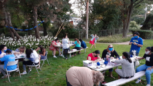 youth working on crafts outside