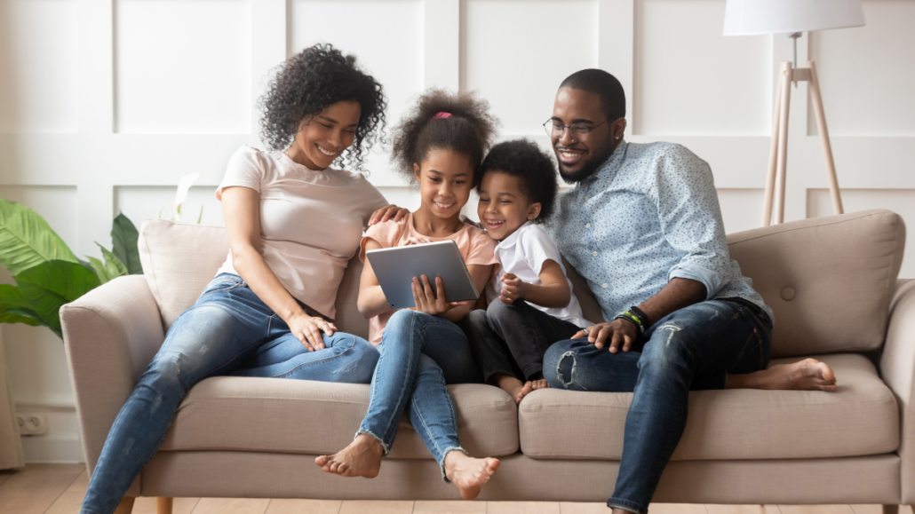 African American family sitting on a couch