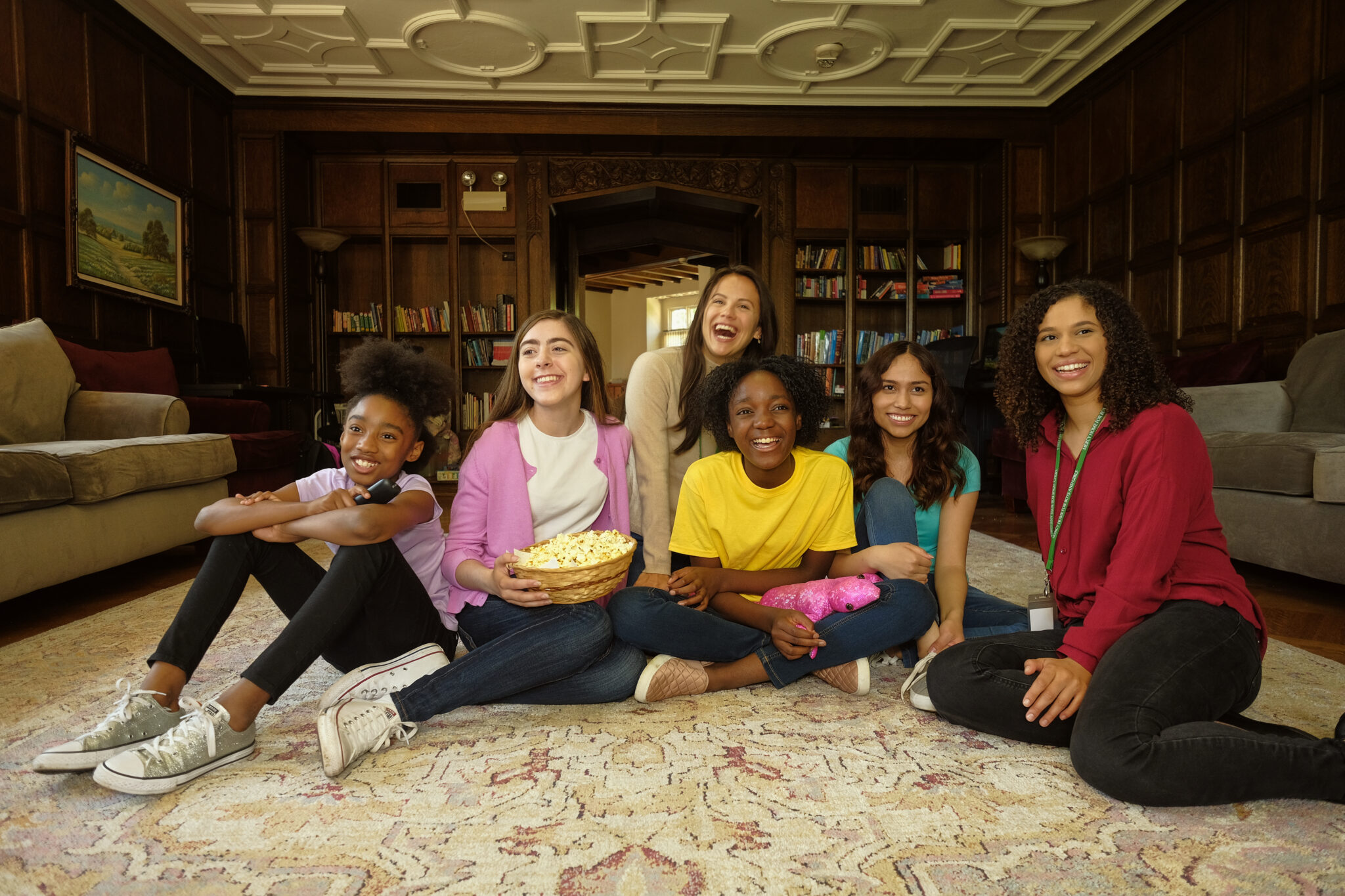 Group of young women watch a movie