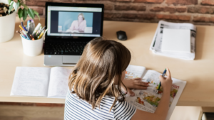 Young girl attending a virtual class