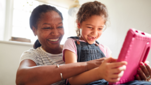 Young girl smiling with her mom