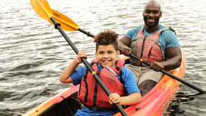 Boy and coworker canoeing