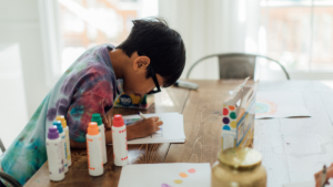 Young boy at a table crafting