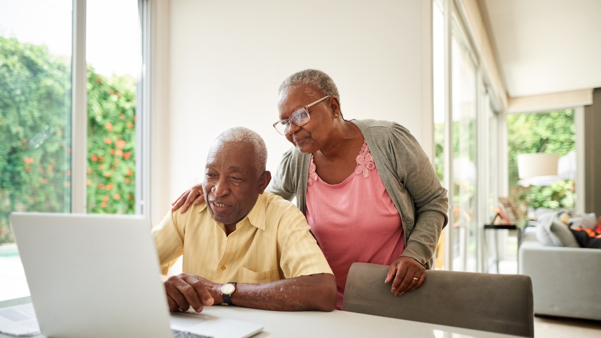 Couple looks at computer screen