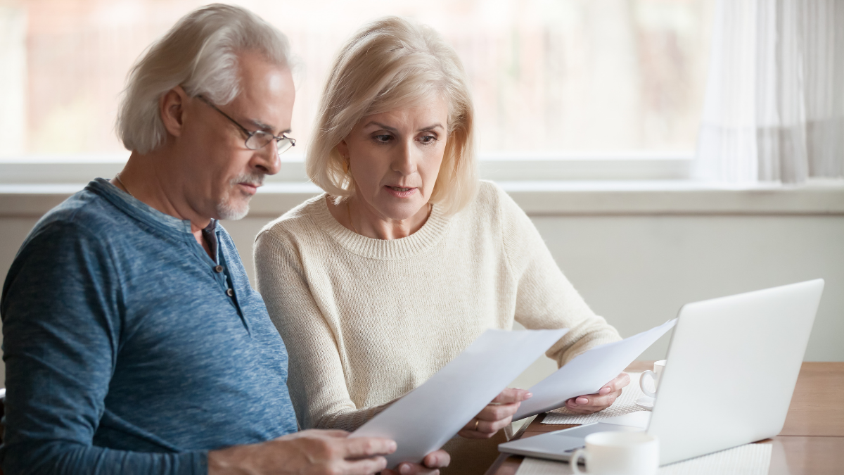 Couple looks over papers together