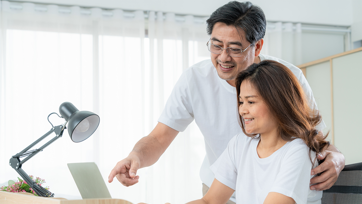 Couple looks at computer