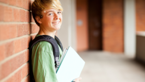 Boy holding books