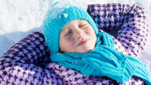 Girl laying in snow