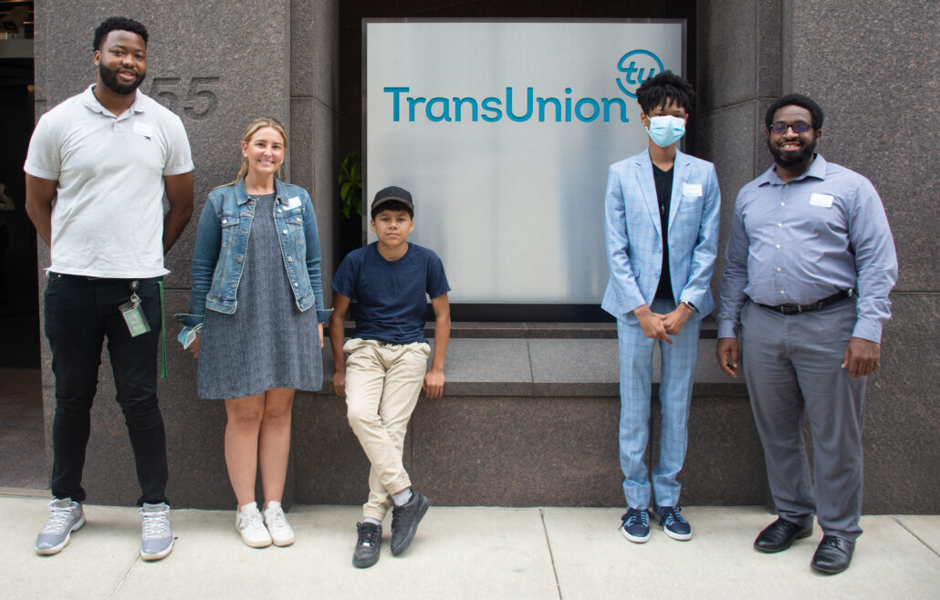 Group stands outside of TransUnion office in Chicago on a visit as part of the Summer Career Institute