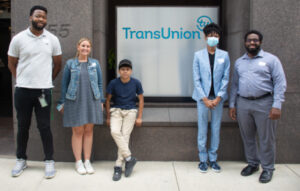 Group stands outside of TransUnion office in Chicago