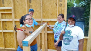 Our young women building a house.