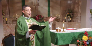 Fr. Carl Morello raises his hands as he celebrates the Twenty-Second Sunday in Ordinary Time with our Sunday Mass community