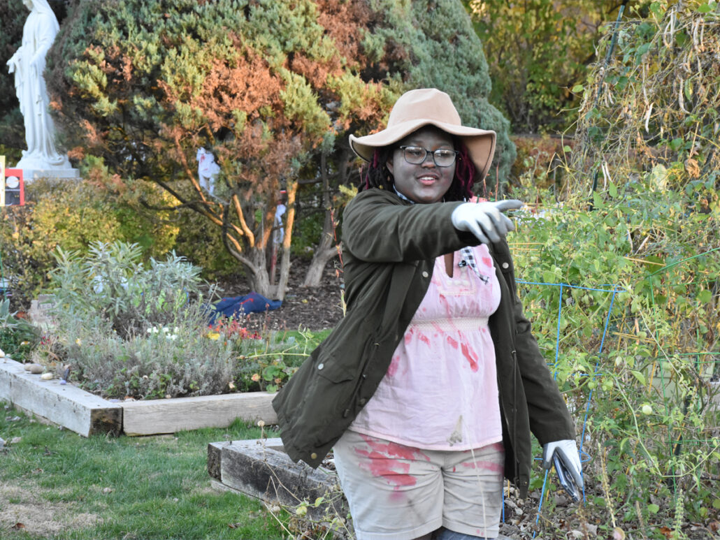 One of our kids walks through our garden dressed as a zombie gardener. 
