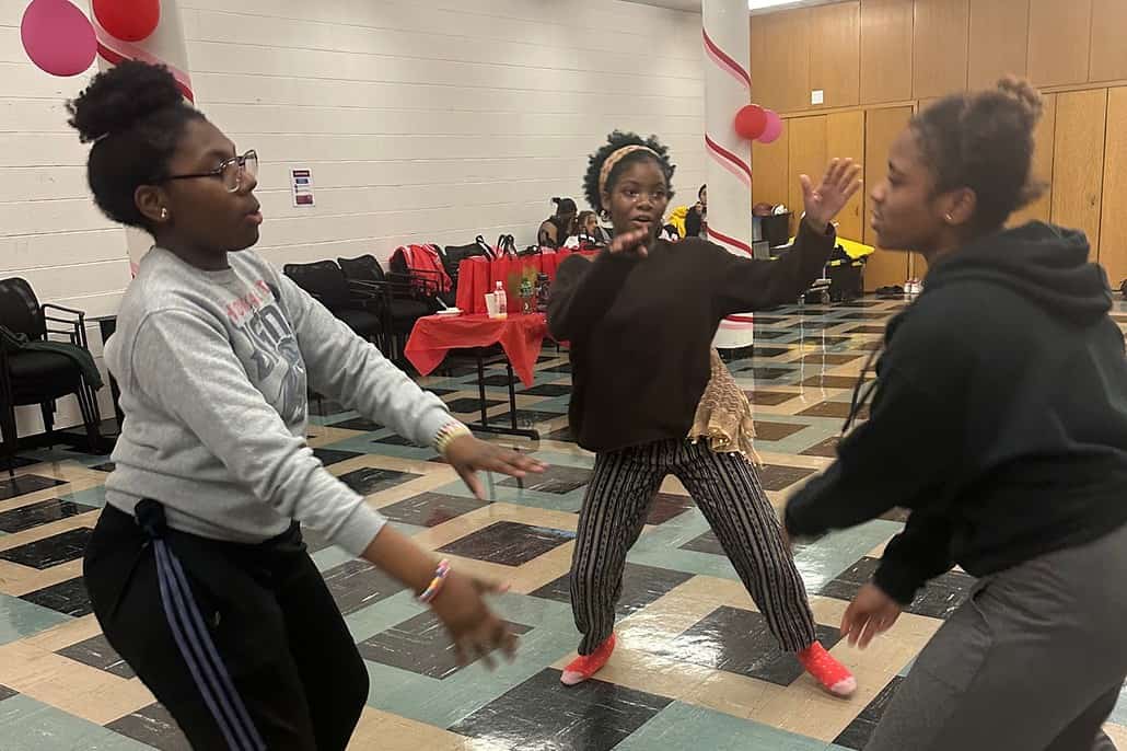 The Mercy Home girls are having a great time step dancing at the sock hop!