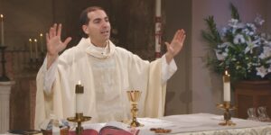 Fr. James Wallace leads mass for Sunday of Divine Mercy for Mercy Home's Sunday Mass community.