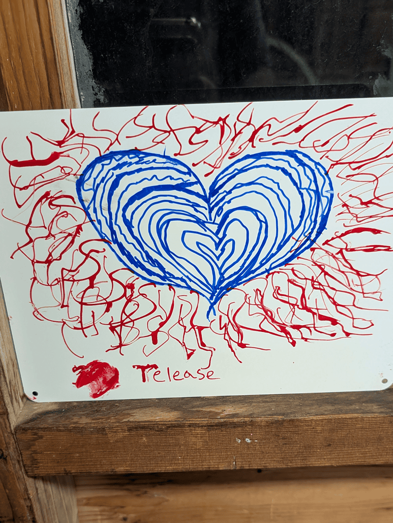 A piece art of art depicting a radiant heart. Made by a Mercy Home youth.